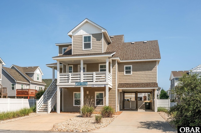 655 Pampas Ct Lot 162, Corolla, NC 27927 - view of front of property featuring a porch, roof with shingles, concrete driveway, stairway, and board and batten siding