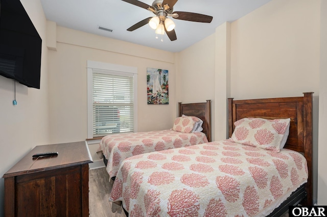 655 Pampas Ct Lot 162, Corolla, NC 27927 - bedroom featuring wood finished floors and a ceiling fan