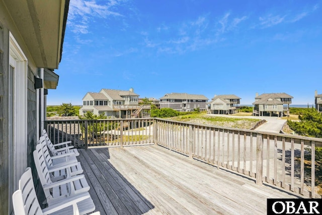 wooden terrace with a residential view