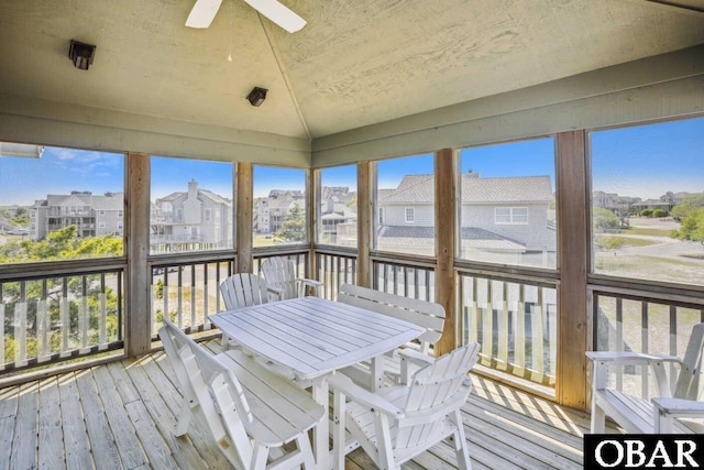 unfurnished sunroom with lofted ceiling and a healthy amount of sunlight