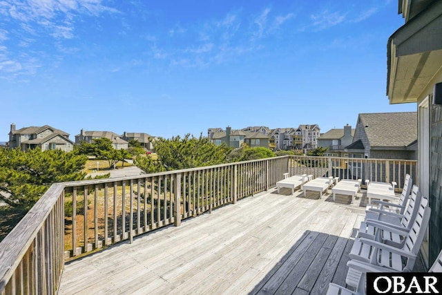 wooden deck with a residential view