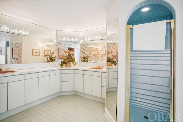 full bath with tile patterned flooring and vanity