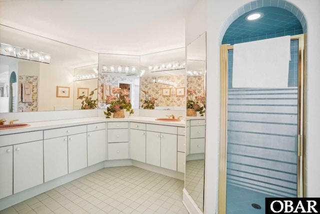 140 N Spinnaker Ct Lot # 20, Duck, NC 27949 - bathroom featuring double vanity, tile patterned floors, and a stall shower