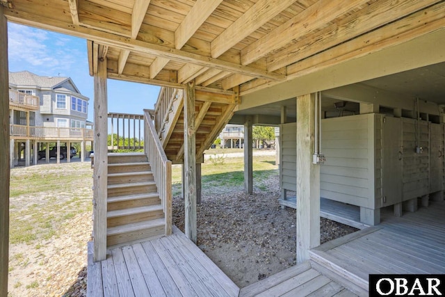 wooden deck featuring stairway