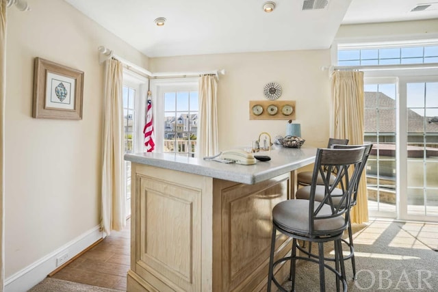 bar featuring recessed lighting, wood finished floors, visible vents, and baseboards