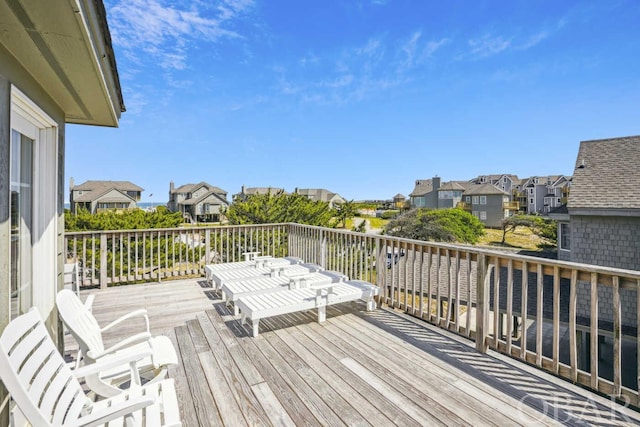 wooden terrace featuring a residential view