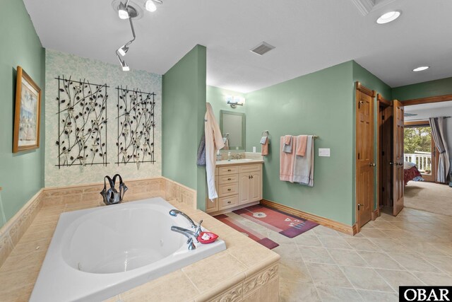 294 Hillcrest Dr Lot 20, Southern Shores, NC 27949 - full bath featuring a jetted tub, vanity, ensuite bathroom, and tile patterned flooring