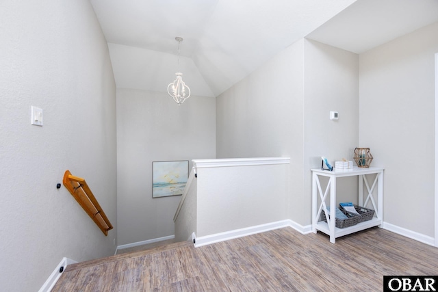 841 Golden Bluff Way Lot 336, Corolla, NC 27927 - stairs with wood finished floors, a chandelier, baseboards, and vaulted ceiling