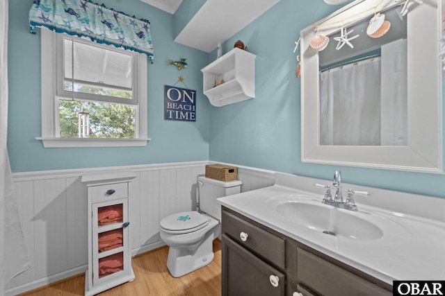 4121 W Whispering Winds Ct Lot 17, Nags Head, NC 27959 - bathroom with a wainscoted wall, wood finished floors, vanity, and toilet