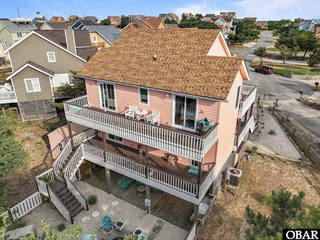 4121 W Whispering Winds Ct Lot 17, Nags Head, NC 27959 - rear view of house with a deck, roof with shingles, a residential view, and central AC