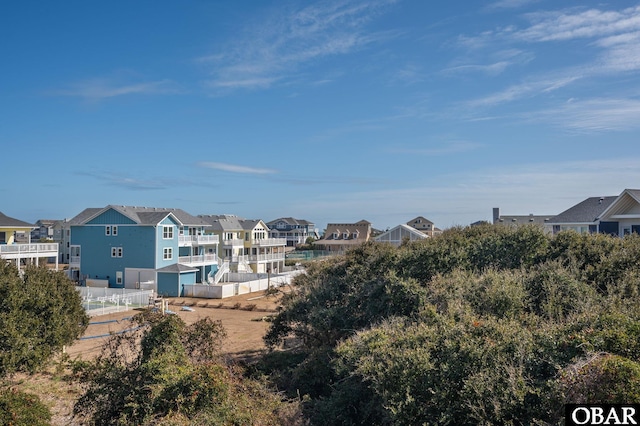 exterior space with fence and a residential view