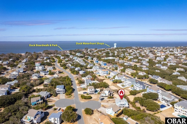 birds eye view of property with a residential view and a water view