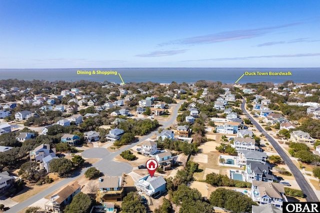 birds eye view of property featuring a residential view and a water view