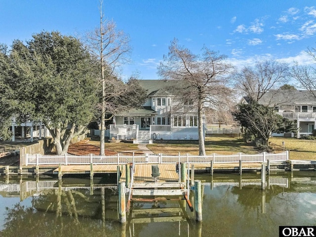4008 Pineway Dr Lot 17, Kitty Hawk, NC 27949 - view of dock with boat lift, a water view, and fence