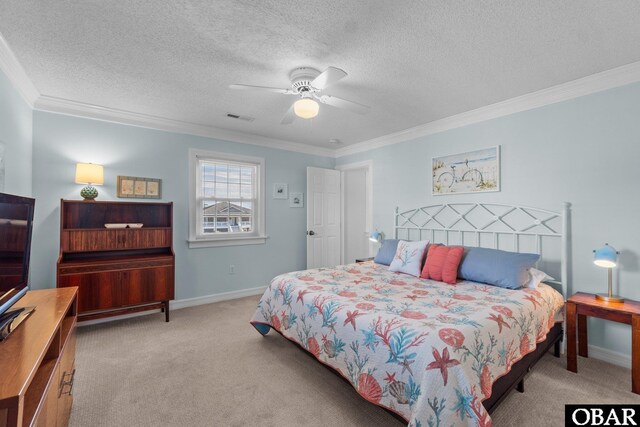 bedroom featuring a textured ceiling, light colored carpet, visible vents, baseboards, and ornamental molding