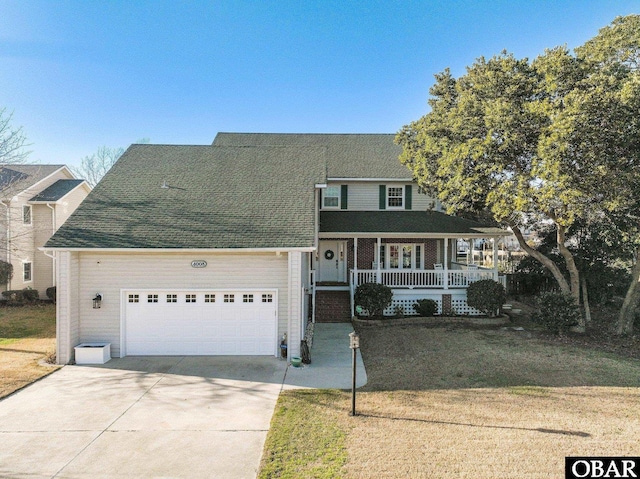 4008 Pineway Dr Lot 17, Kitty Hawk, NC 27949 - view of front of home with covered porch, a garage, concrete driveway, a front lawn, and roof with shingles