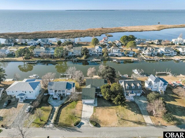 birds eye view of property with a residential view and a water view