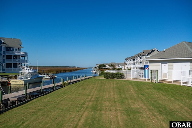 424 Pirates Way Unit 424A, Manteo, NC 27954 - view of yard featuring a dock, fence, and a water view