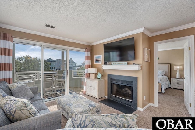 424 Pirates Way Unit 424A, Manteo, NC 27954 - carpeted living room featuring a fireplace with flush hearth, a textured ceiling, ornamental molding, and visible vents