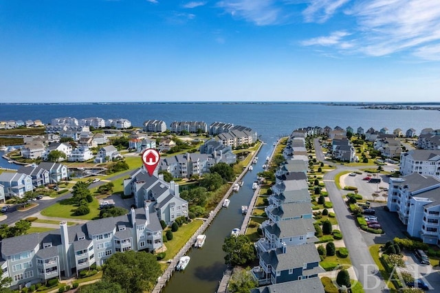 bird's eye view with a water view and a residential view