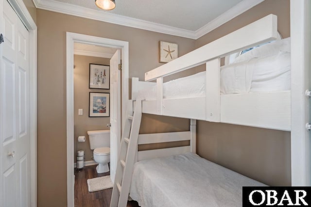 424 Pirates Way Unit 424A, Manteo, NC 27954 - bedroom featuring crown molding and wood finished floors