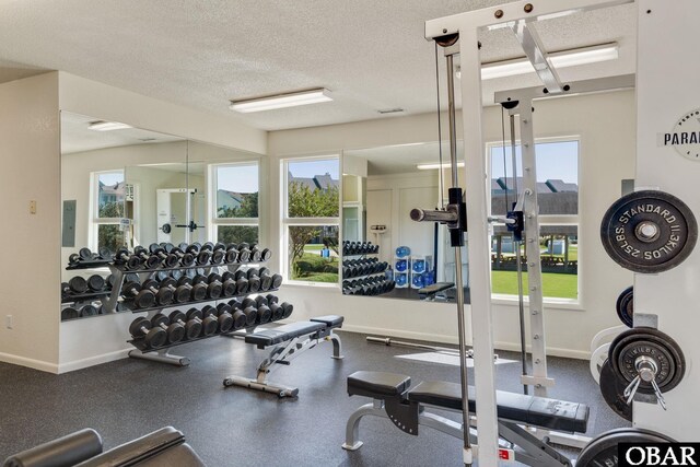 424 Pirates Way Unit 424A, Manteo, NC 27954 - gym featuring baseboards, electric panel, and a textured ceiling