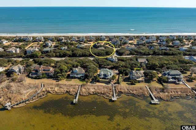 aerial view featuring a view of the beach and a water view