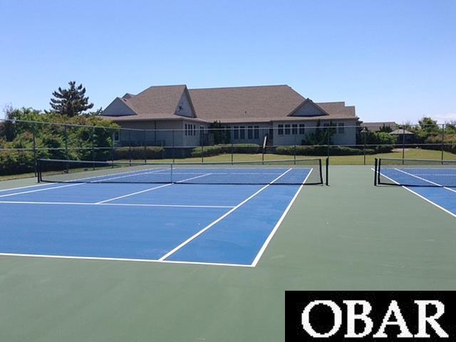 view of sport court with community basketball court and fence