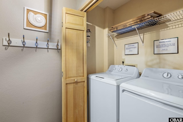 washroom featuring laundry area and washer and dryer