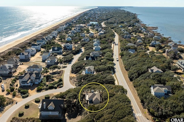 aerial view featuring a water view and a view of the beach