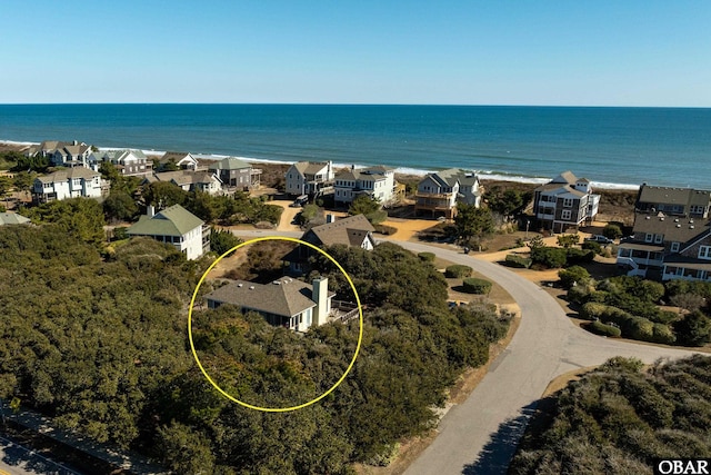 drone / aerial view with a water view and a residential view