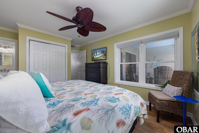 5515 S Virginia Dare Trl Unit B-3, Nags Head, NC 27959 - bedroom with crown molding, wood finished floors, a closet, and ceiling fan