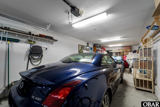 100F Mercedes Ct Unit F, Grandy, NC 27939 - garage featuring a garage door opener
