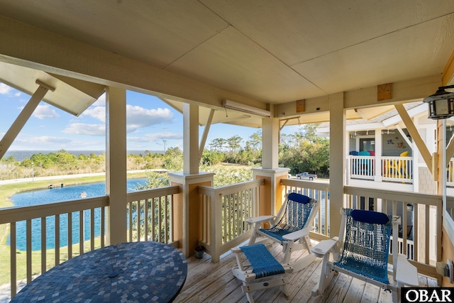 100F Mercedes Ct Unit F, Grandy, NC 27939 - deck with a water view and outdoor dining area