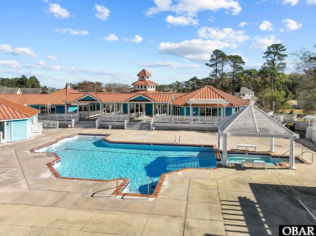 100F Mercedes Ct Unit F, Grandy, NC 27939 - community pool featuring a wooden deck and a patio