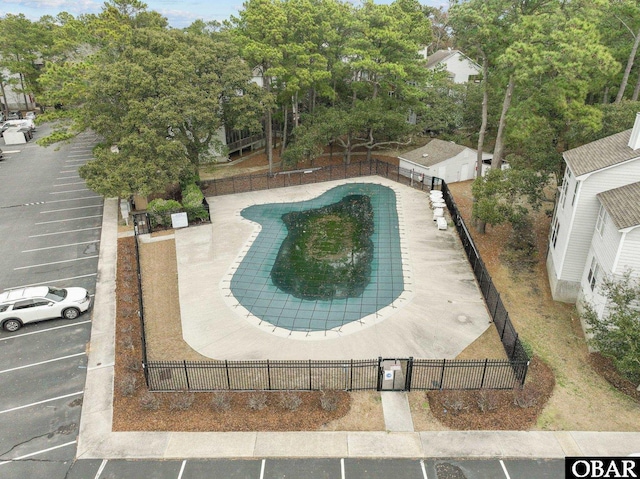 view of pool featuring fence