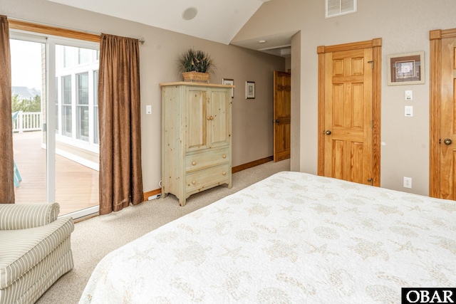 bedroom with lofted ceiling, light carpet, visible vents, baseboards, and access to exterior