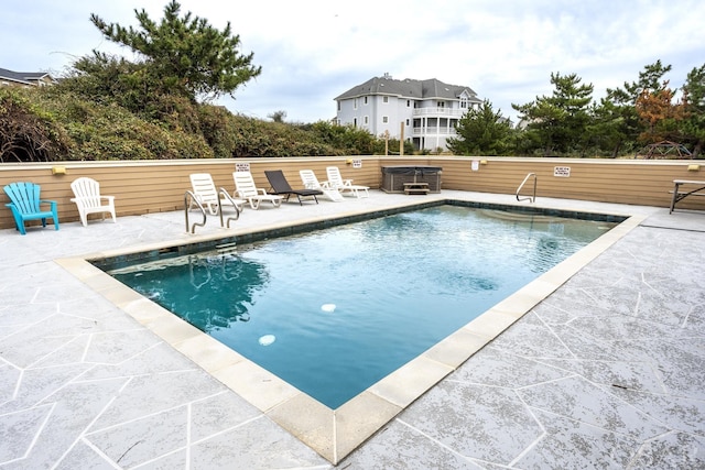 pool featuring a patio area