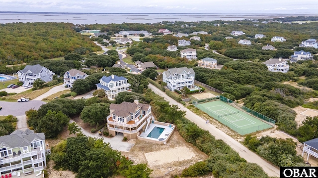 birds eye view of property with a water view and a residential view