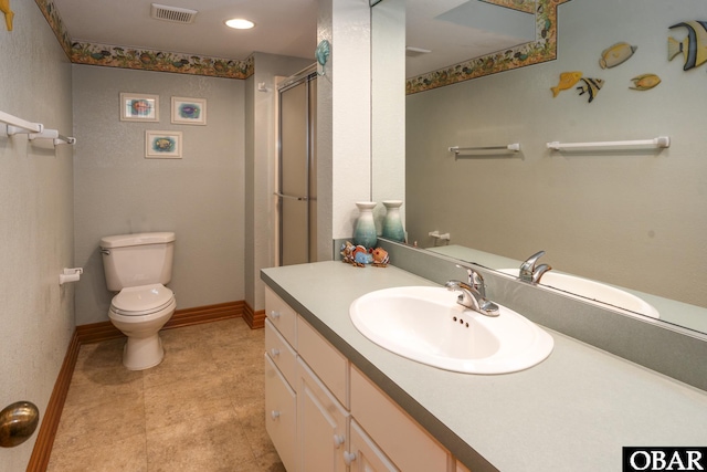 full bathroom featuring visible vents, toilet, a shower with shower door, vanity, and baseboards