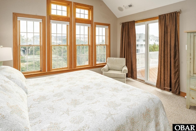 bedroom featuring access to outside, visible vents, lofted ceiling, and carpet