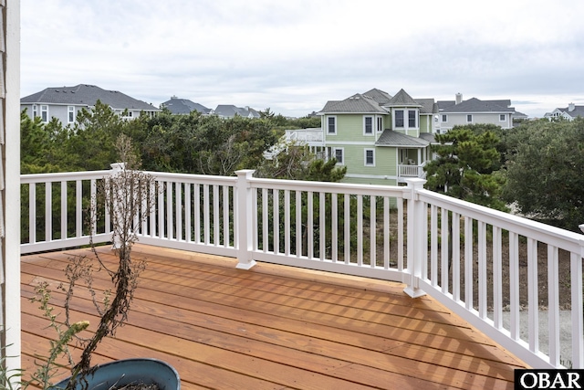 wooden terrace with a residential view