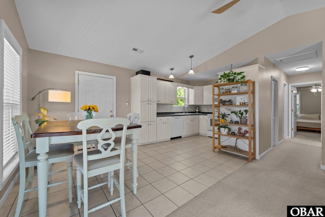 410 W Wilkinson St Lot 26-28, Kill Devil Hills, NC 27948 - kitchen featuring white dishwasher, dark countertops, a ceiling fan, lofted ceiling, and white cabinetry