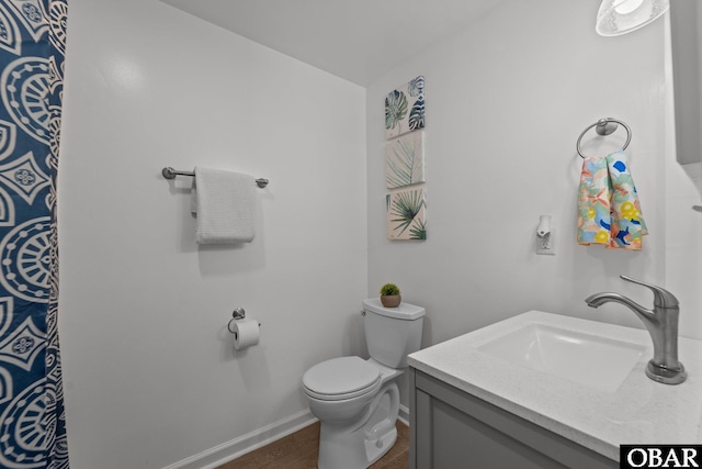 410 W Wilkinson St Lot 26-28, Kill Devil Hills, NC 27948 - full bath with vanity and wood finished floors