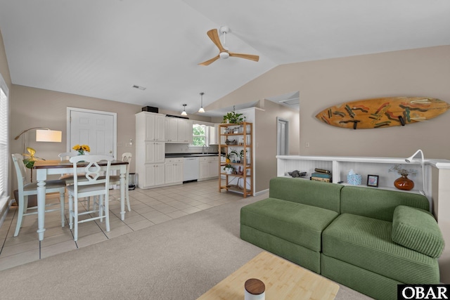410 W Wilkinson St Lot 26-28, Kill Devil Hills, NC 27948 - living area with lofted ceiling, a ceiling fan, light tile patterned floors, and light colored carpet