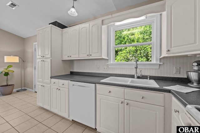 410 W Wilkinson St Lot 26-28, Kill Devil Hills, NC 27948 - kitchen featuring dishwasher, light tile patterned flooring, dark countertops, white cabinets, and decorative light fixtures