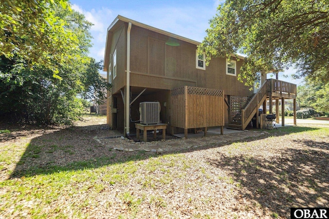 410 W Wilkinson St Lot 26-28, Kill Devil Hills, NC 27948 - rear view of property with stairway and a wooden deck