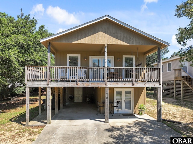 410 W Wilkinson St Lot 26-28, Kill Devil Hills, NC 27948 - rear view of property featuring a deck and french doors