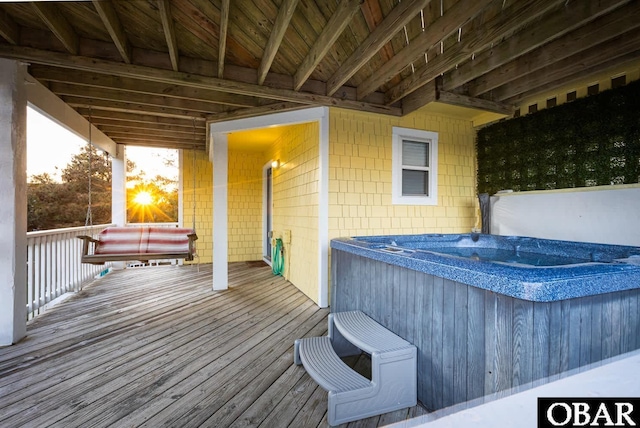 wooden terrace with a hot tub