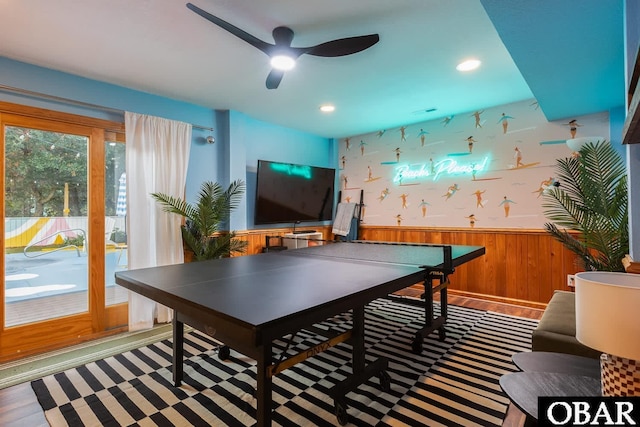 recreation room featuring recessed lighting, ceiling fan, and wainscoting